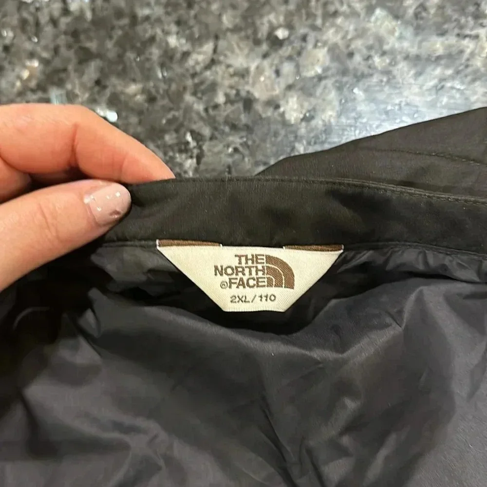 The North Face black puffer vest full front zip, pockets, front and back logo